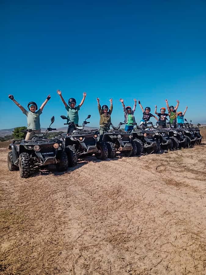 CAPE TOWN: OSTRICH RANCH QUAD BIKE RIDE & OSTRICH TOUR - Quad biking with Table Mountain in the distance