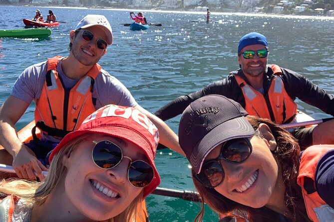 Kayak Adventure at Clifton Beach - Getting ready with a PFD, paddle, and phone case