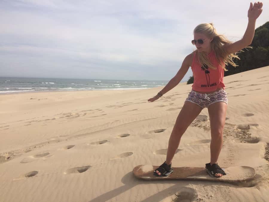 Sandboarding Jeffreys Bay - Sitting boards make this work for families