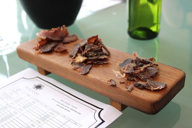 Stellenbosch&Franschhoek wineTasting Private Tour From Cape Town - Marianne pairs wine with biltong