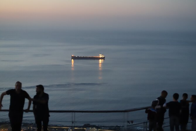 Summer Sunset Bus Tour in Cape Town - Passing Camps Bay on the road to Signal Hill