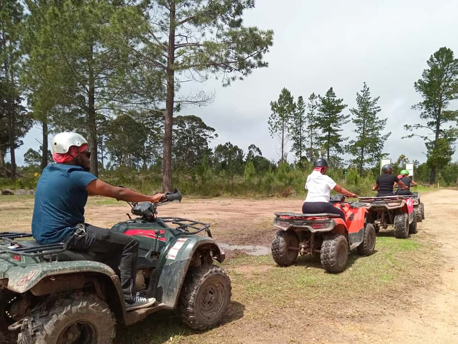 THE CRAGS PLETTENBERG BAY: QUAD BIKE FUN RIDE - Following the guide through trees and bushes